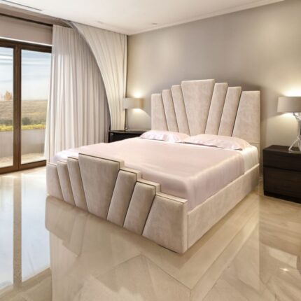 A luxurious beige upholstered bed by King’s Touch Furniture, featuring a geometric panel headboard and matching footboard in a modern bedroom with marble floors, neutral walls, and large windows with white curtains.