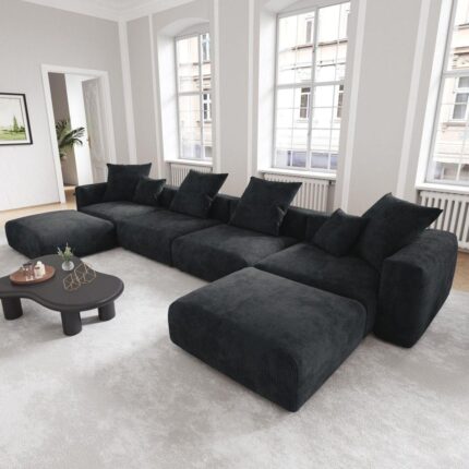 “Black Ariana corduroy U-shaped modular sofa with plush cushions and low-profile design, perfect for modern living rooms.”