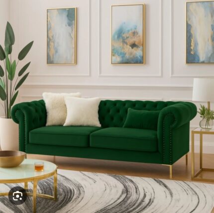 “Chesterfield 2-seater sofa in emerald green with deep button tufting, rolled arms, and plush velvet upholstery.”